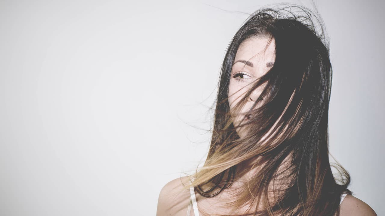A woman with her hair caught in the wind
